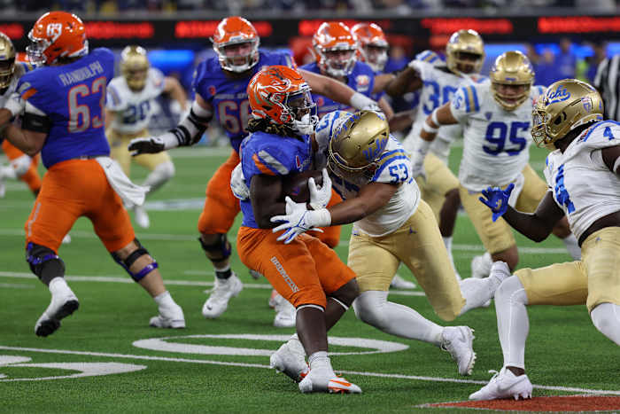 iDec 16, 2023; Inglewood, CA, USA; UCLA Bruins linebacker Darius Muasau (53) tackles Boise State Broncos running back Ashton Jeanty (2) during the third quarter of the LA Bowl at SoFi Stadium. Mandatory Credit: Kiyoshi Mio-USA TODAY Sports  